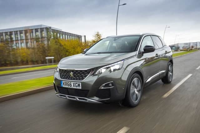 The Peugeot 3008 has body skirts, scuff plates and a new grille to house the lion emblem.