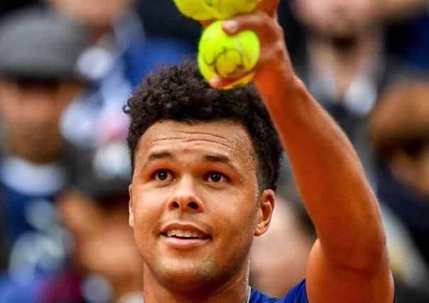 France's Jo-Wilfried Tsonga celebrates after winning against  Serbia's Laslo Djere in their singles rubber in the Davis Cup semi-final in Lille. Picture: Philippe Huguen/AFP/Getty Images