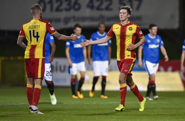 Partick Thistle's Blair Spittal (right) celebrates his equaliser with Christie Elliott. Picture: SNS