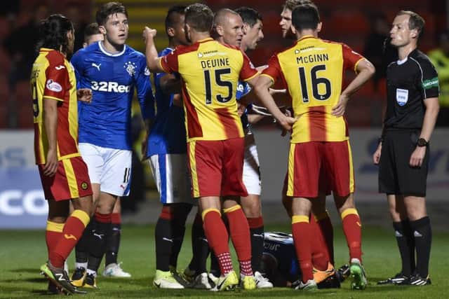 Players from both sides clash during a fiery encounter. Picture: SNS