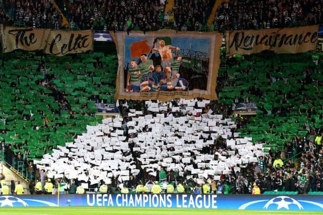 Celtic fans hold lights up during the UEFA Champions League, Group B match at Celtic Park. Picture: Andrew Milligan/PA Wire