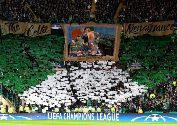 Celtic fans hold lights up during the UEFA Champions League, Group B match at Celtic Park. Picture: Andrew Milligan/PA Wire