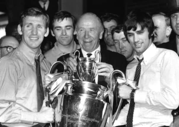 Sir Matt Busby holds the European Cup in 1968 with George Best and Pat Crerand. Picture:  Bob Aylott/Keystone/Getty Images