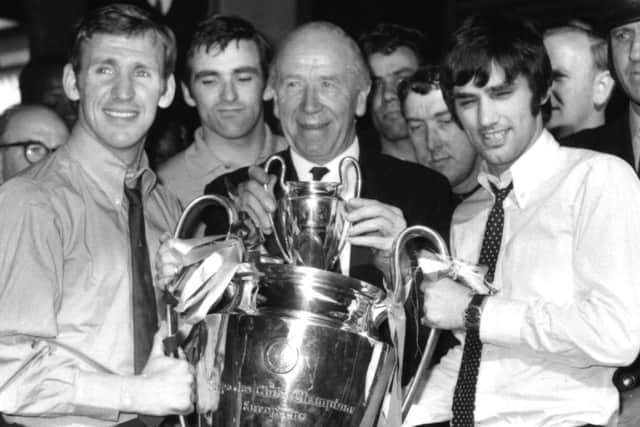 Sir Matt Busby holds the European Cup in 1968 with George Best and Pat Crerand. Picture:  Bob Aylott/Keystone/Getty Images