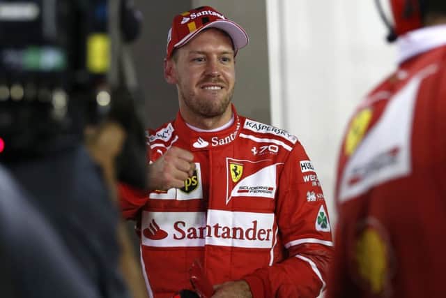 Sebastian Vettel starts todays Singapore Grand Prix as clear favourite after seizing pole position with a record-breaking lap. Photograph: AP Photo/Yong Teck Lim