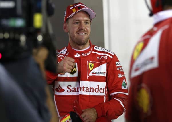 Sebastian Vettel starts todays Singapore Grand Prix as clear favourite after seizing pole position with a record-breaking lap. Photograph: AP Photo/Yong Teck Lim