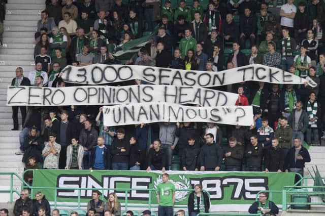Hibernian fans unveil banner aimed at the club. Picture: SNS/Ross Parker