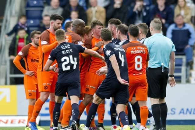 Dundee United and Falkirk players exchange words after a late Paul McMullan challenge. Picture: SNS/Gary Williamson