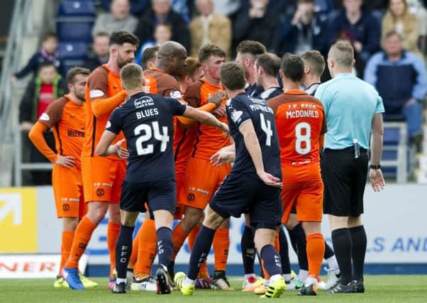 Dundee United and Falkirk players exchange words after a late Paul McMullan challenge. Picture: SNS/Gary Williamson