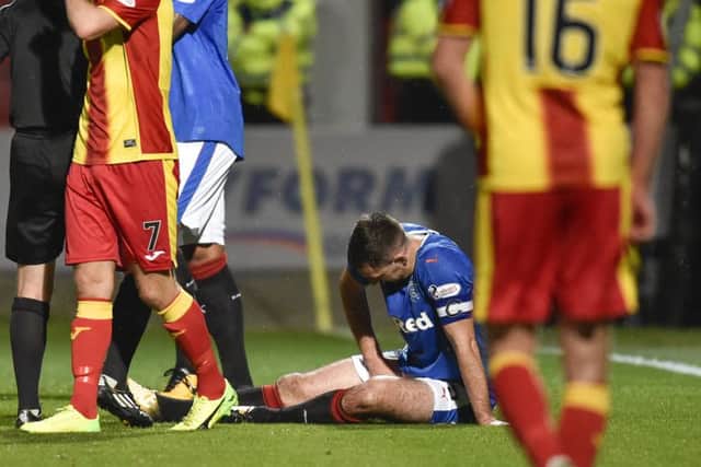 Rangers' Lee Wallace goes down with an injury during the team's draw with Partick Thistle. Picture: SNS/Rob Casey