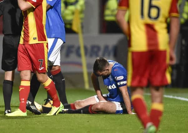 Rangers' Lee Wallace goes down with an injury during the team's draw with Partick Thistle. Picture: SNS/Rob Casey