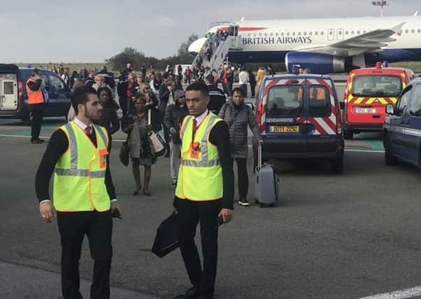 British Airways flight number BA0303 was held on the tarmac at Charles de Gaulle airport in Paris because of what a passenger has said was a "direct threat" to the plane. Picture: @jsa/PA Wire
