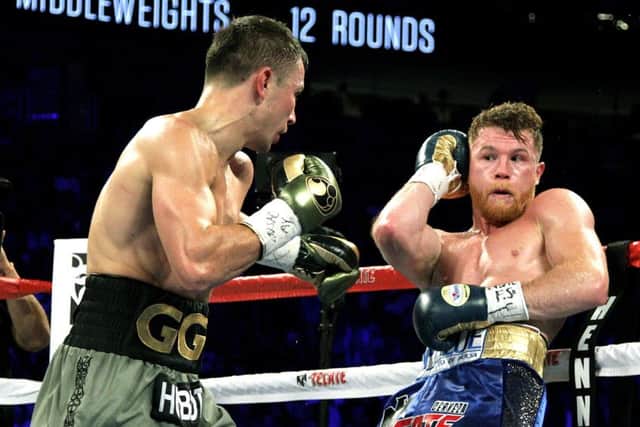 Canelo Alvarez, right, on the defensive during Saturday nights Las Vegas bout with Gennady Golovkin. Picture: AFP/Getty.