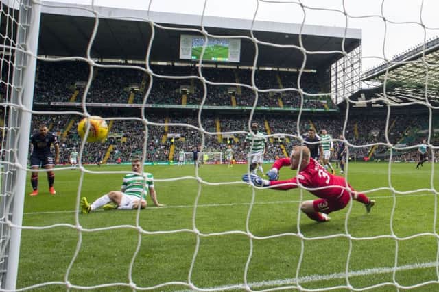 James Forrest stabs home the third goal of Celtic's comfortable victory over Ross County. Picture: Rob Casey/SNS