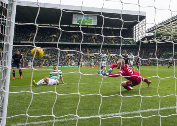 James Forrest stabs home the third goal of Celtic's comfortable victory over Ross County. Picture: Rob Casey/SNS