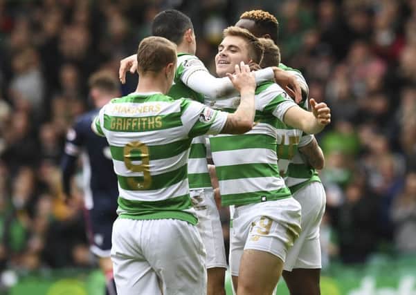 James Forrest (right) celebrates his goal with his team-mates. Picture: SNS.