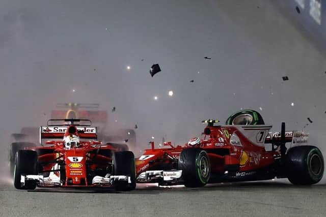 The two Ferraris collide at the start of the Singapore GP. Picture: Lars Baron/Getty Images