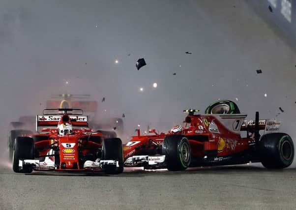 The two Ferraris collide at the start of the Singapore GP.  Picture: Lars Baron/Getty Images