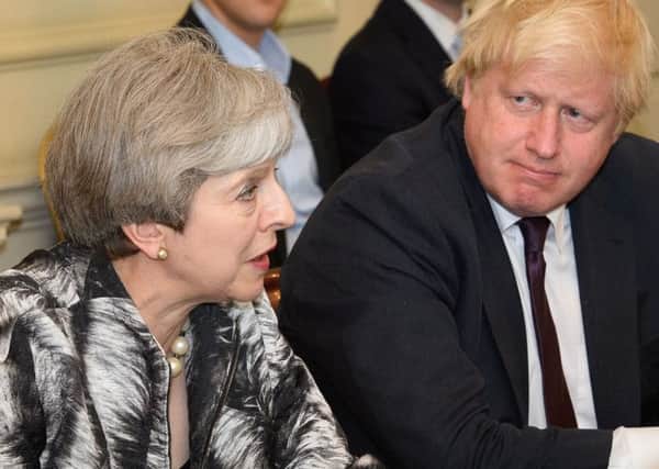 Theresa May with Boris Johnson. Picture: Leon Neal/PA Wire