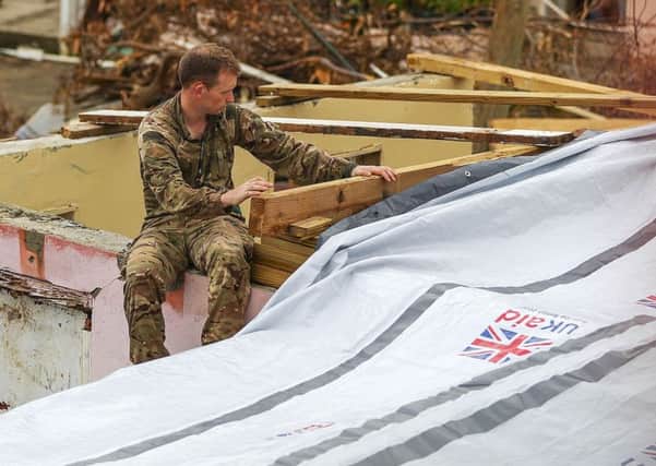 The couple who lost their home when Hurricane Irma ravaged the British Virgin Islands have been helped by UK troops to try and rebuild their house. Picture: LPhot Joel Rouse/Royal Navy/MOD/Crown copyright/PA Wire