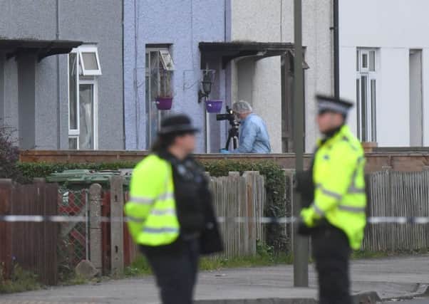 Police and forensic officers at property in Sunbury-on-Thames, Surrey, as part of the investigation into the Parsons Green bombing. Picture: PA
