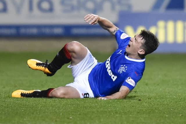 Ryan Jack feels the effects of a challenge from Ryan Edwards. Picture: SNS