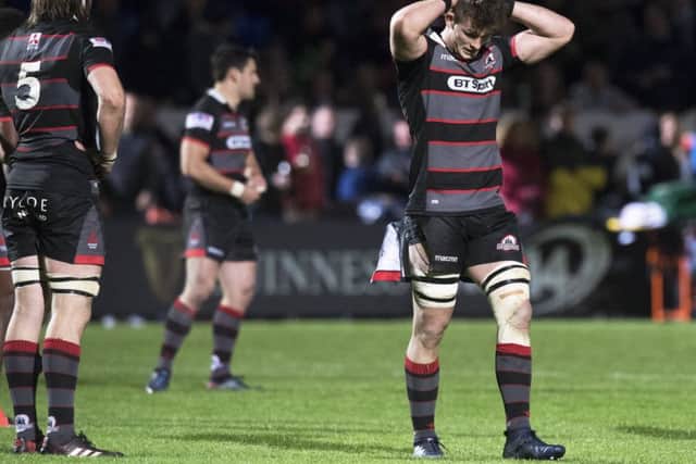 Marcus Bradbury holds his head in despair after Edinburghs defeat by Treviso last Friday, but Andy Irvine, inset, believes Myreside crowds will soon be seeing regular home victories. Picture: SNS.