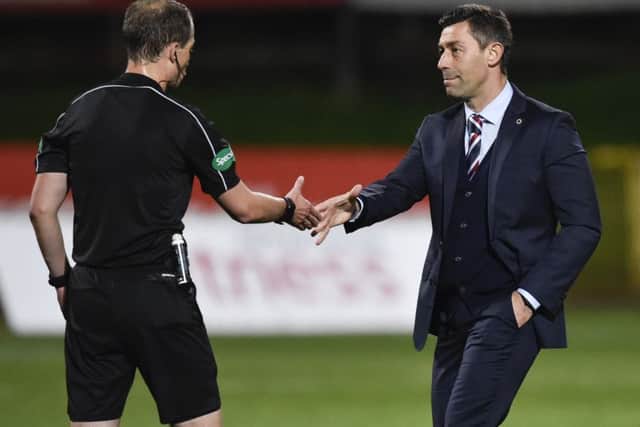 Rangers manager Pedro Caixinha (right) with referee Willie Collum at full-time on Friday. Picture: SNS