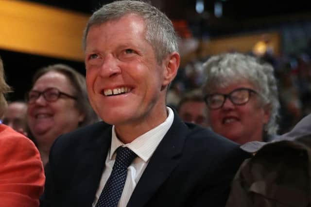 Leader of the Scottish Liberal Democrats Willie Rennie (centre) listens to a speech by Tim Farron MP at the Liberal Democrats conference. Picture: Andrew Matthews/PA Wire