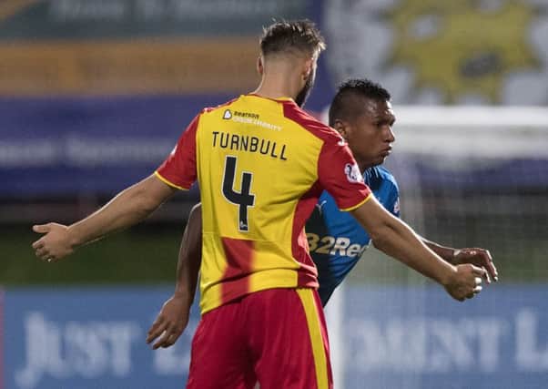 Rangers' Alfredo Morelos (right) clashes with Jordan Turnbull. Picture: SNS