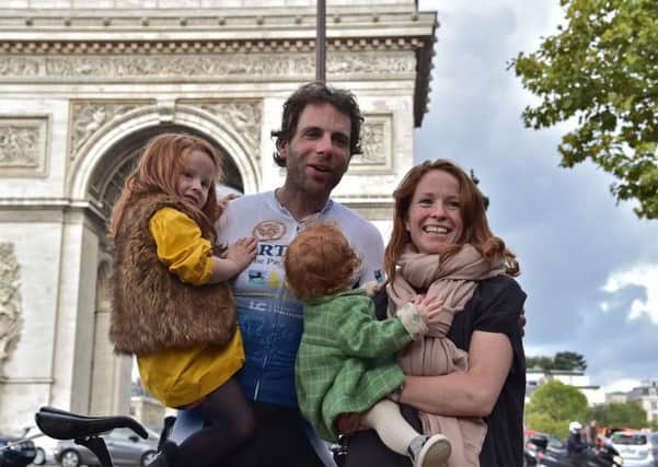 The 34-year-old Scotsman set a new world record for circumnavigating the globe on a bike when he arrived at the Arc de Triomphe in Paris today. Picture: Getty Images