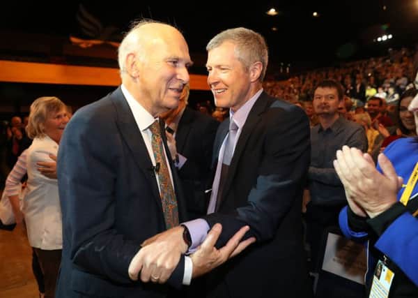Liberal Democrats leader Sir Vince Cable is congratulated by Leader of the Scottish Liberal Democrats Willie Rennie after making his keynote speech at his party's annual conference at the Bournemouth International Centre. PRESS ASSOCIATION Photo. Picture date: Tuesday September 19, 2017. See PA story POLITICS LibDems. Photo credit should read: Andrew Matthews/PA Wire