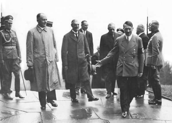 Nazi leader Adolf Hitler (right) with British Prime Minister Neville Chamberlain (centre), during Chamberlain's visit to Munich, which led to the Munich Agreement, September 1938. From second, left: Hitler's interpreter Paul Schmidt, Chamberlain, British Ambassador to Germany Nevile Henderson, and German Foreign Minister Joachim von Ribbentrop. PIC: Hulton Archive/Getty Images