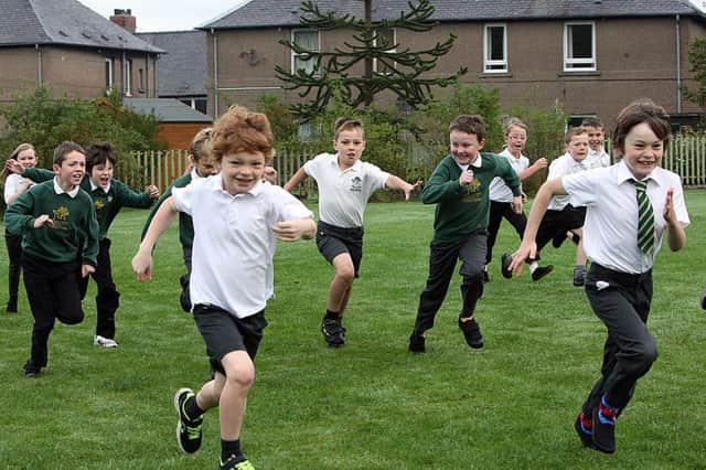 Workers are being urged to copy pupils in completing a Daily Mile. Picture: Dave Scott