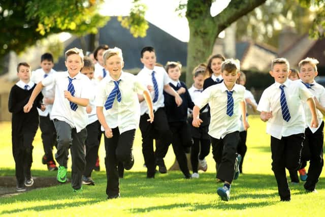 Pupils at St Agatha's Primary in Leven take part in the Daily Mile. Now companies are being encouraged to follow schools and take up the challenge.