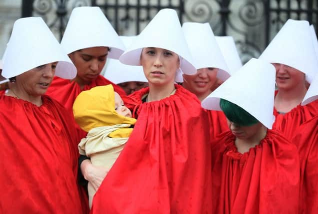 Pro-choice campaigners known as Handmaids protest in Ireland Photo credit should read: Brian Lawless/PA Wire