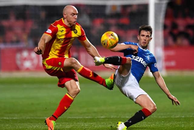 Rangers' Ryan Jack (right) competes with Conor Sammon. Picture: SNS