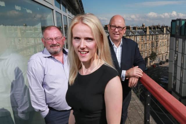 iMultiply chief Kirsty Mackenzie with advisory board member George Elliott, left, and chairman John Anderson. Picture: Stewart Attwood