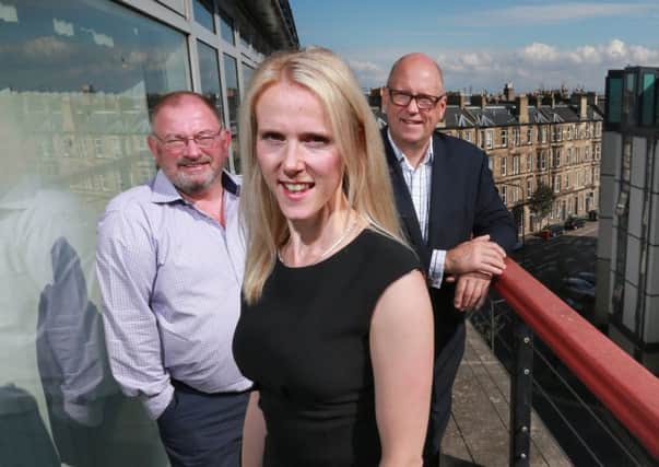 iMultiply chief Kirsty Mackenzie with advisory board member George Elliott, left, and chairman John Anderson. Picture: Stewart Attwood