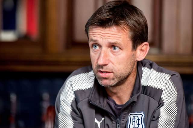 Neil McCann will watch his side take on Celtic at Dens Park. Picture: SNS