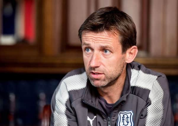Neil McCann will watch his side take on Celtic at Dens Park. Picture: SNS