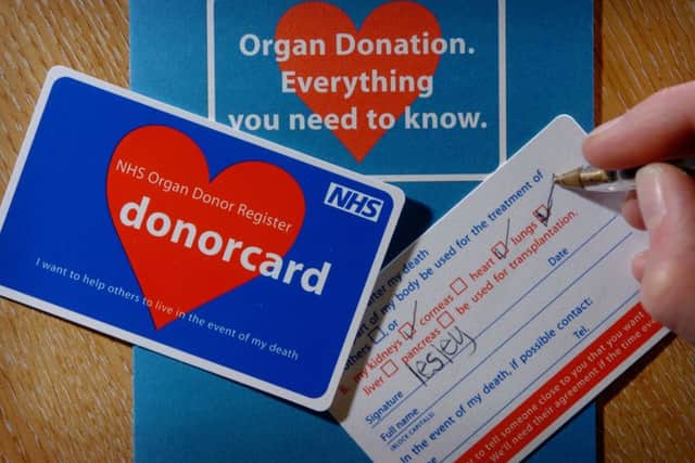 an opt-in system enables persons to specifically instruct that their organs be removed for transplantation after death (for example, by carrying a donor card