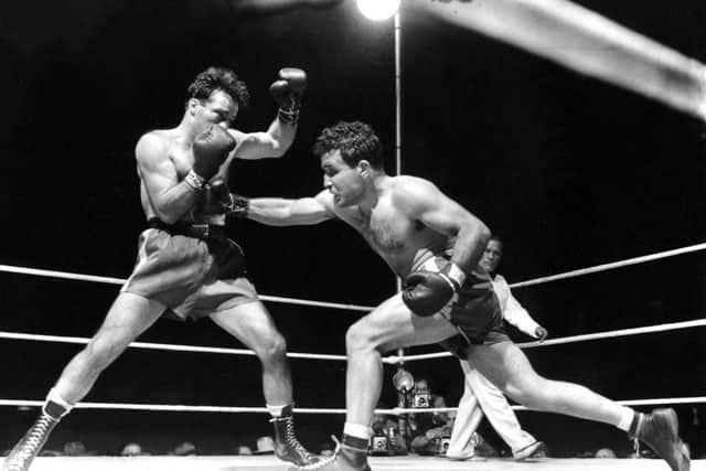 Jake LaMotta, right, fighting Marcel Cerdan in Briggs Stadium in Detroit in 1949. Picture: AP