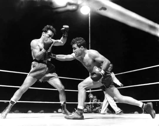 Jake LaMotta, right, fighting Marcel Cerdan in Briggs Stadium in Detroit in 1949. Picture: AP
