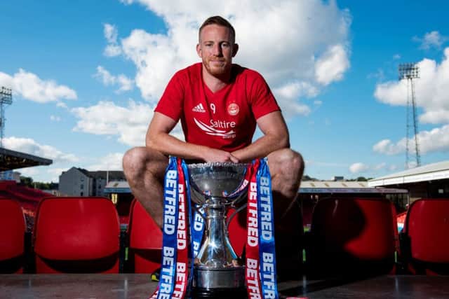 Adam Rooney says the Aberdeen squad is the strongest he has known during his time at the club. Picture: SNS