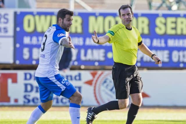 Ricky Foster remonstrates with referee Alan Muir after a penalty is given against the full-back. Picture: SNS