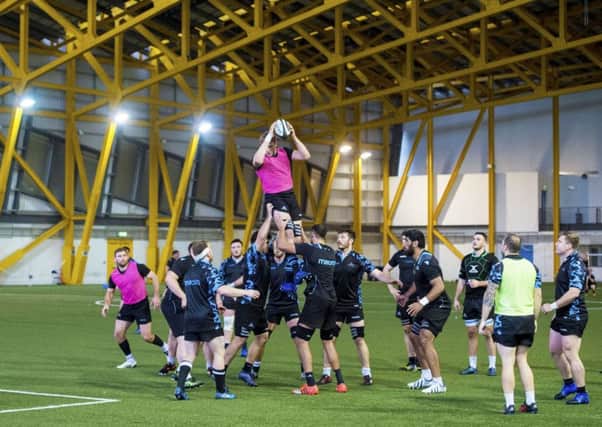 The Glasgow squad go through a lineout drill at Ravenscraig's indoor facility ahead of tonight's top of Conference A clash with Munster. Picture: SNS