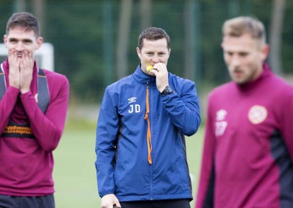 Hearts coach Jon Daly supervises training as head coach Craig Levein takes a back seat. Picture: SNS.