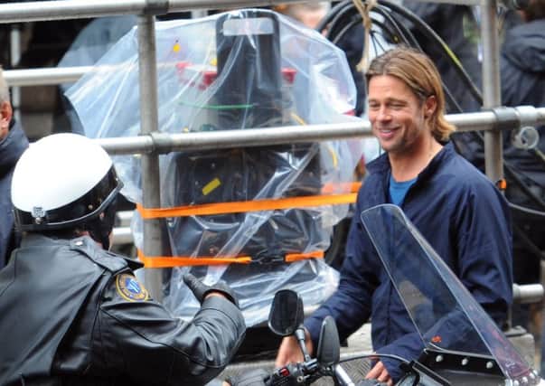 Brad Pitt in Cochrane Street, Glasgow, after filming a scene for the film World War Z in 2011. Picture: Robert Perry