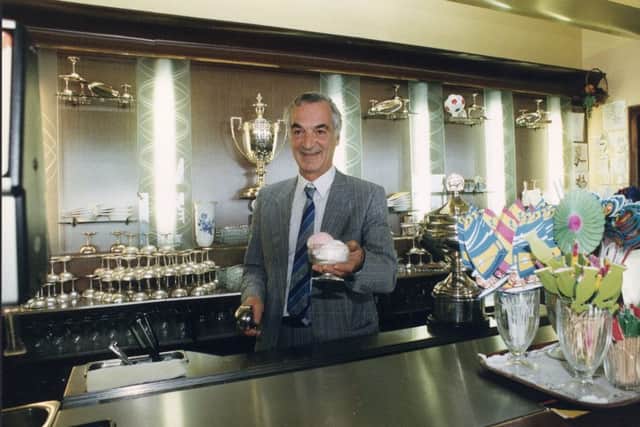 Peter Nardini, the Ice Cream king at Nardini's Cafe in Largs. Behind him are the trophies his family has won for their ice cream. Picture: TSPL